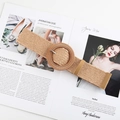 Detail of woven straw belt featuring a large round buckle and faux leather tip - Round Buckle Light Camel