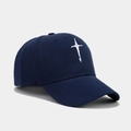 Close-up of navy blue twill cotton baseball cap with white cross embroidery on the front - Navy Blue