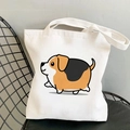 White canvas tote bag featuring a cute cartoon yoga beagle dog print on a black chair - Colorful Illustration Beagle