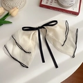 Elegant cream white chiffon bow hair claw clip with black piping detail on white surface - Silk Gauze Bow Spring Clip / Off White