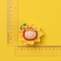 Handmade knitted sunflower keychain with a cute face on a vibrant yellow background - MENGSI Orange Sunflower Dumpling