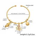 Detail size map of gold shell and octopus charm bangle in stainless steel - Gold