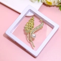 Golden feather brooch with yellow crystals and pearl displayed in a white frame - XZ169-Gold Yellow Diamond Leaf-Boxed