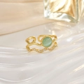 Detail of gold double-layer open ring featuring green opal stone and tiny zircons - Green Opal Wave Double Layer (JZ0149B)