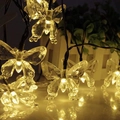 Guirnalda de luces LED solares de mariposa para decoración de jardín y patio exterior - 5m 20 LEDs / Tono Cálido