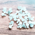 Mini light blue mushroom stone ornaments with polished finish on a wooden surface - White Cat's Eye
