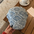 Detail of light blue denim beret with star patch and frayed edges on wooden table - Light Blue Frayed Edge Star