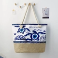 Detail of canvas beach bag with turtle evil eye print, jute bottom and rope handles - Sea Turtle Totem Decor