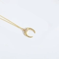 Elegant gold crescent moon necklace with sparkling cubic zirconia on a minimalist chain - Crescent Moon / Gold