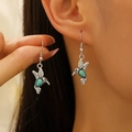 Dettaglio degli orecchini vintage a colibrì in argento con pietre di turchese - Argento Retro Turchese Colibrì Gancio (9520)
