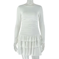 Detail of elegant white long sleeve dress showing layered ruffle hem and pleated waist - S / White