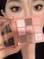 Close-up of a 9-color matte and shimmer eyeshadow palette in warm nude tones - No. 12 Pink Tones (3CE Style)
