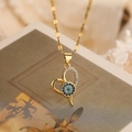 Collana a cuore in oro 18K con zircone occhio del male su sfondo floreale vintage - Cuore d'oro Malocchio