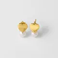Macro detail of golden heart studs with polished finish and round white pearls - Style C-Heart Shape Pearl