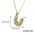 Golden letter U pendant necklace with colorful zircons on a fine twisted chain - Letter U