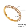 Golden stainless steel band ring featuring brilliant pavé-set round cubic zirconia - US 6 / Gold with White Zirconia