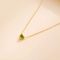 Gold heart pendant necklace featuring a vibrant green birthstone and 18k gold plating - August-Peridot