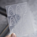Close-up of F-7 nail art stencil with concentric arc patterns and transparent texture - Concentric Arc Style (F-7)