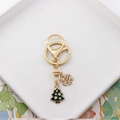 Detailed view of Christmas tree and snowflake charms with inlaid rhinestones on a gold keychain - Christmas Tree Snowflake (Rhinestone)