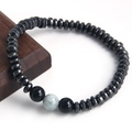Minimalist beaded bracelet with matte black natural stones and three central accent beads - Matte Agate Obsidian Hematite
