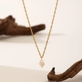 Minimalist gold necklace with a single white pearl pendant on a natural wooden branch - H23 Water Ripple Chain Baroque Pearl Necklace Gold