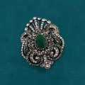 Vintage bronze brooch with teardrop green gemstone and crystals on dark texture - Spider Lily Hollow Style / Antique Silver + Green Water Drop