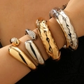 Close-up of chunky gold and silver textured metal bracelets with rhinestones on arm - Chunky Stackable Bangle Set (72) / 4 Pieces/Set (Gold/Silver/Rhinestone) / Multicolor