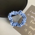 Minimalist elastic scrunchie featuring a blue and white checkered fabric pattern - Blue Grid