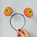 Cute felt orange persimmon headband with green clover detail on a black plastic frame - Persimmon Hairband