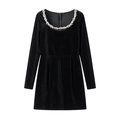 Detail of beaded neckline and luxury velvet texture on long sleeve black mini dress - S / Bottoms / Velvet Black