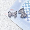 Detailed view of silver butterfly charms for DIY jewelry with 18mm x 14mm dimensions - 31# Silver Star Butterfly