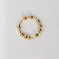 Dettaglio delle perline dorate rotanti su un anello anti-ansia in acciaio inox - US 5 / Oro (Acciaio Inossidabile)