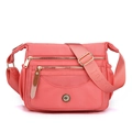 Waterproof coral pink nylon crossbody bag with multi-layer zipper compartments and fox logo - Sakura Pink