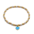 Detailed macro view of 4mm tricolor metal beads with a blue enamel heart charm bracelet - Mixed Color Blue