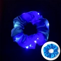 Blue LED satin scrunchie glowing in the dark and shown in normal daylight view - Glowing Blue