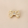 Macro detail of a 18K gold plated bow pendant with micro-set zircon for DIY jewelry - PJ0240-Gold (Bowknot)