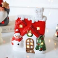 Christmas ceramic snow house LED light with miniature snowman and green festive tree - Snowman House 10.5x7.8x12.8cm