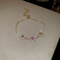 Detail of adjustable gold bracelet with pink square zircons and sparkling star filter effect - 53# Gold Three Pink Square Style