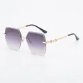 Lunettes de soleil sans monture surdimensionnées avec verres dégradés violets et branches d'or - Monture Dorée Verres Gris Dégradés