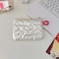 Macro view of white quilted heart cosmetic bag with gold zipper and pink puller - Heart Quilted Beige Coin Purse