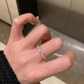 Detailed view of elegant pink and clear crystal band ring worn on hand for styling - Pink and White Gemstone Inlaid Eternity Ring (J5913)