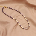 Baroque pearl and amethyst necklace with gold beads on pink silk background - Baroque Amethyst Pearl Necklace
