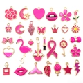Macro view of assorted pink and gold enamel zinc alloy charms in various cute shapes - Rose Red New 30 Style (HK554)
