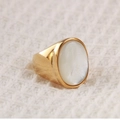 Detail of polished gold ring featuring a large oval white shell inlay on knit fabric - US 10 / Gold Mother of Pearl