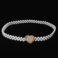 Detailed view of elastic pearl waist chain featuring a gold heart buckle with rhinestones - Golden Heart-Shaped Rhinestone Clasp Artificial Pearl Chain (Style 12)