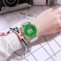 Transparent green digital square watch with resin strap worn by a female model - Green