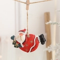Resin Santa Claus ornament with green gift boxes hanging on twine for Christmas decor - Santa with Gift Bags