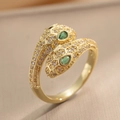 Luxurious gold double-headed snake ring with green stones and sparkling zircon pavé - Gold (642)