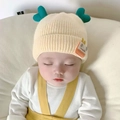 Cute yellow baby winter knit hat with green heart accent and sun patch ear protection - One Size / GOOD Heart Style / Off White