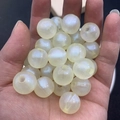 Macro shot of luminous iridescent beads for DIY bracelets with pearl finish - 16mm / Yellow